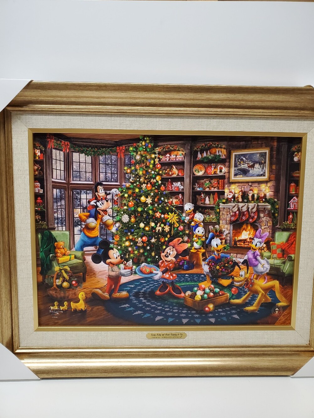 Thomas Kinkade Studios Disney Christmas mickey and minnie trimming the tree Art